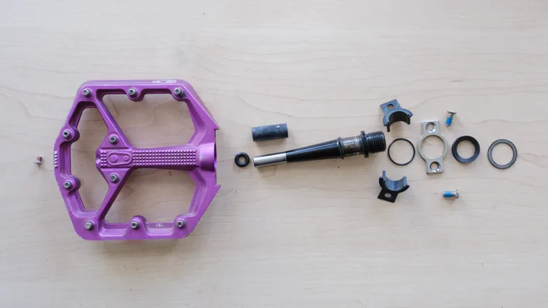 A variety of pedal components arranged in the right order for assembly