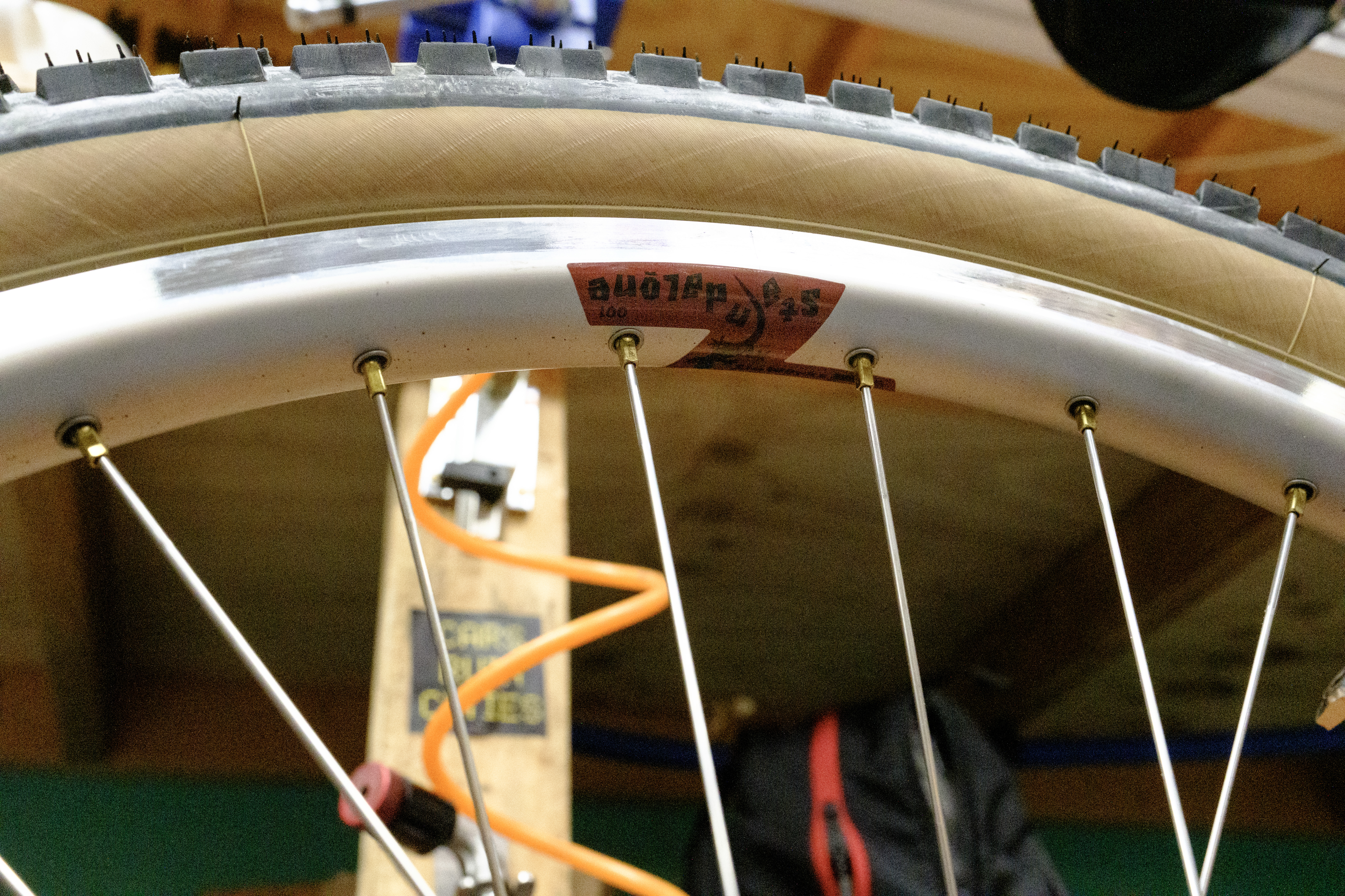 A close up of the brass nipples and SimWorks Standalone 001 rim.