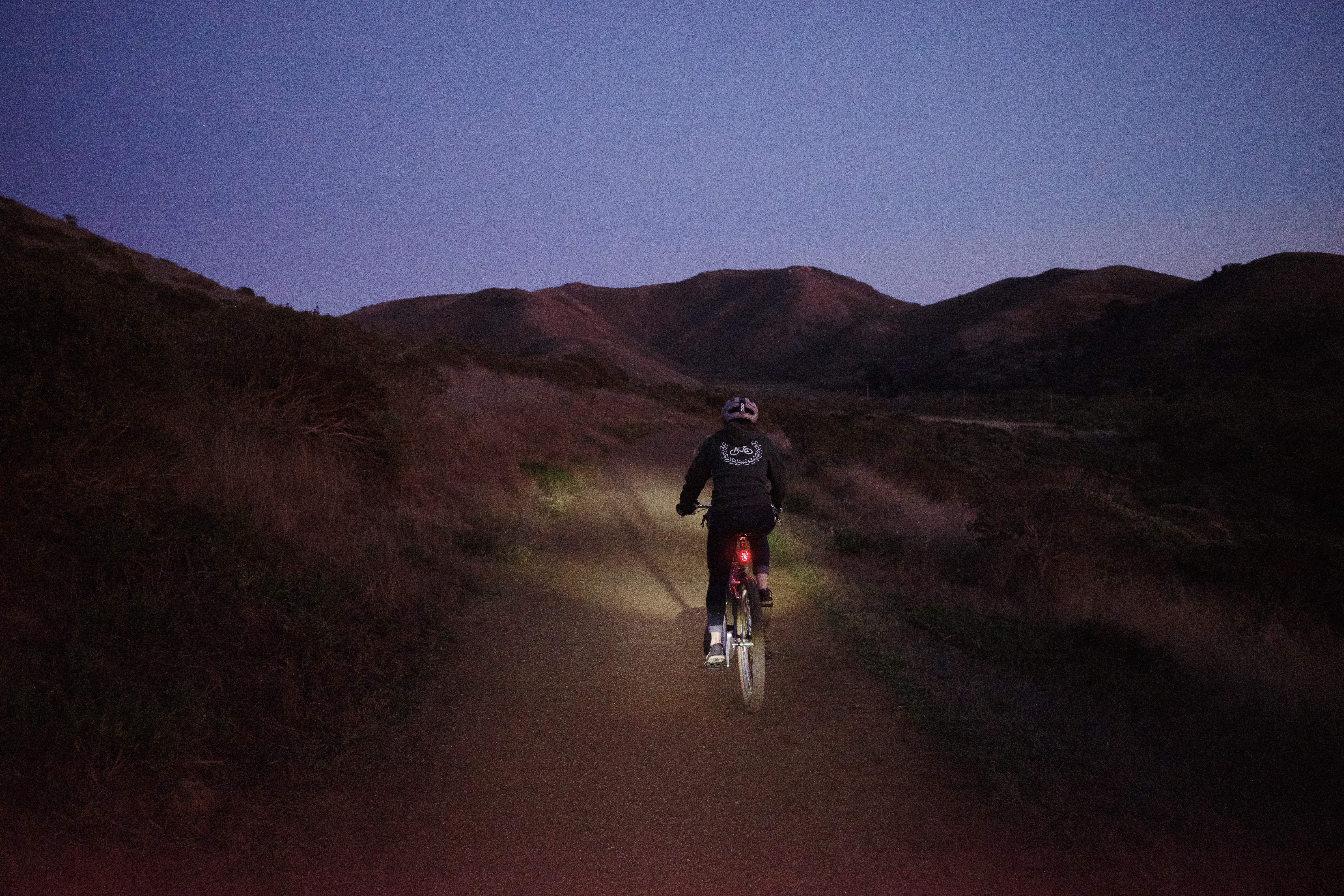 Kat riding well past sunset towards Bunker Rd