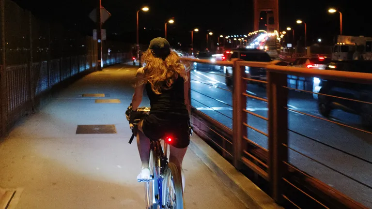 Kat riding around the bend on one of the Golden Gate Bridge towers