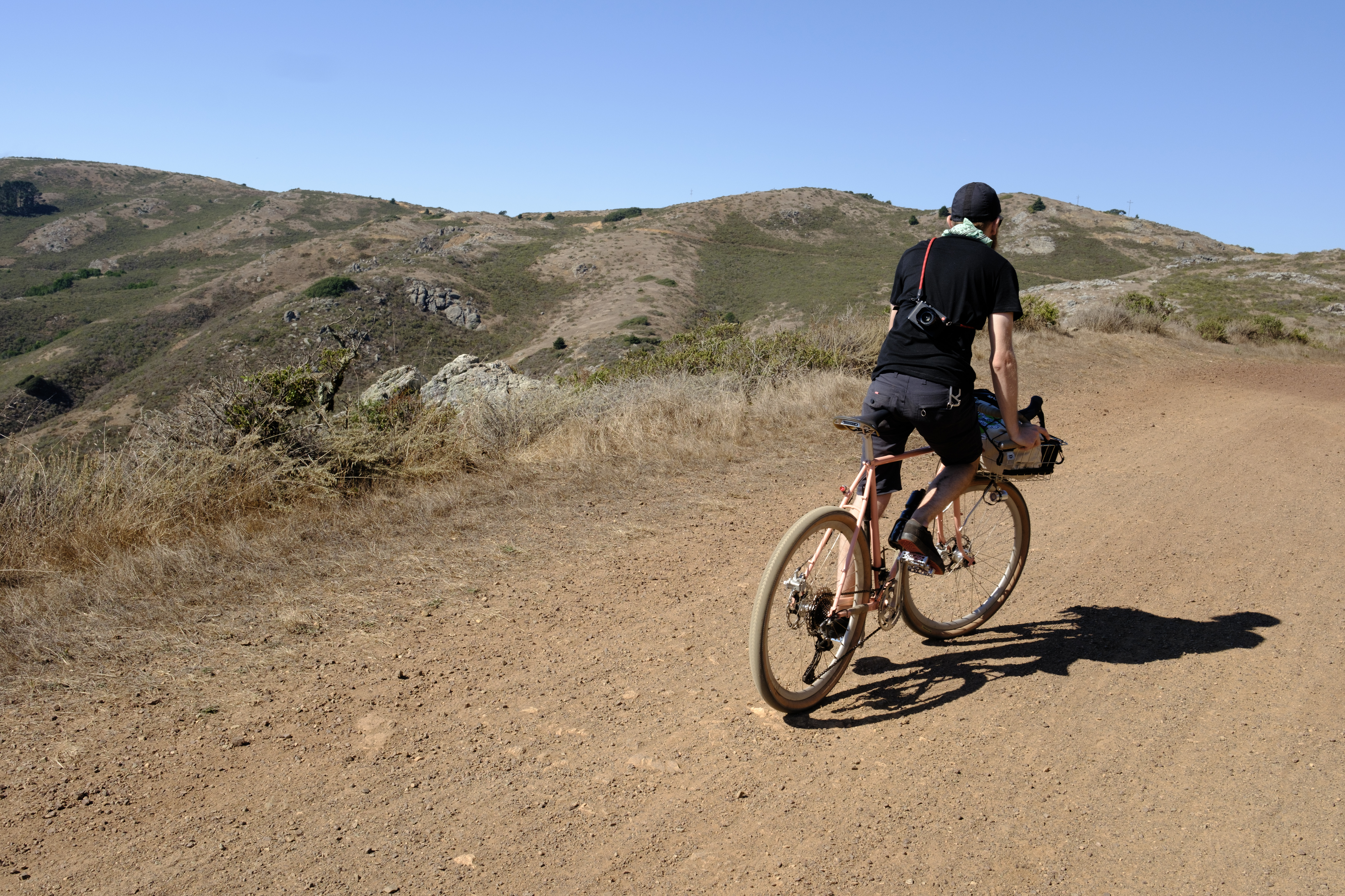 Ben riding out of the saddle up a hill.