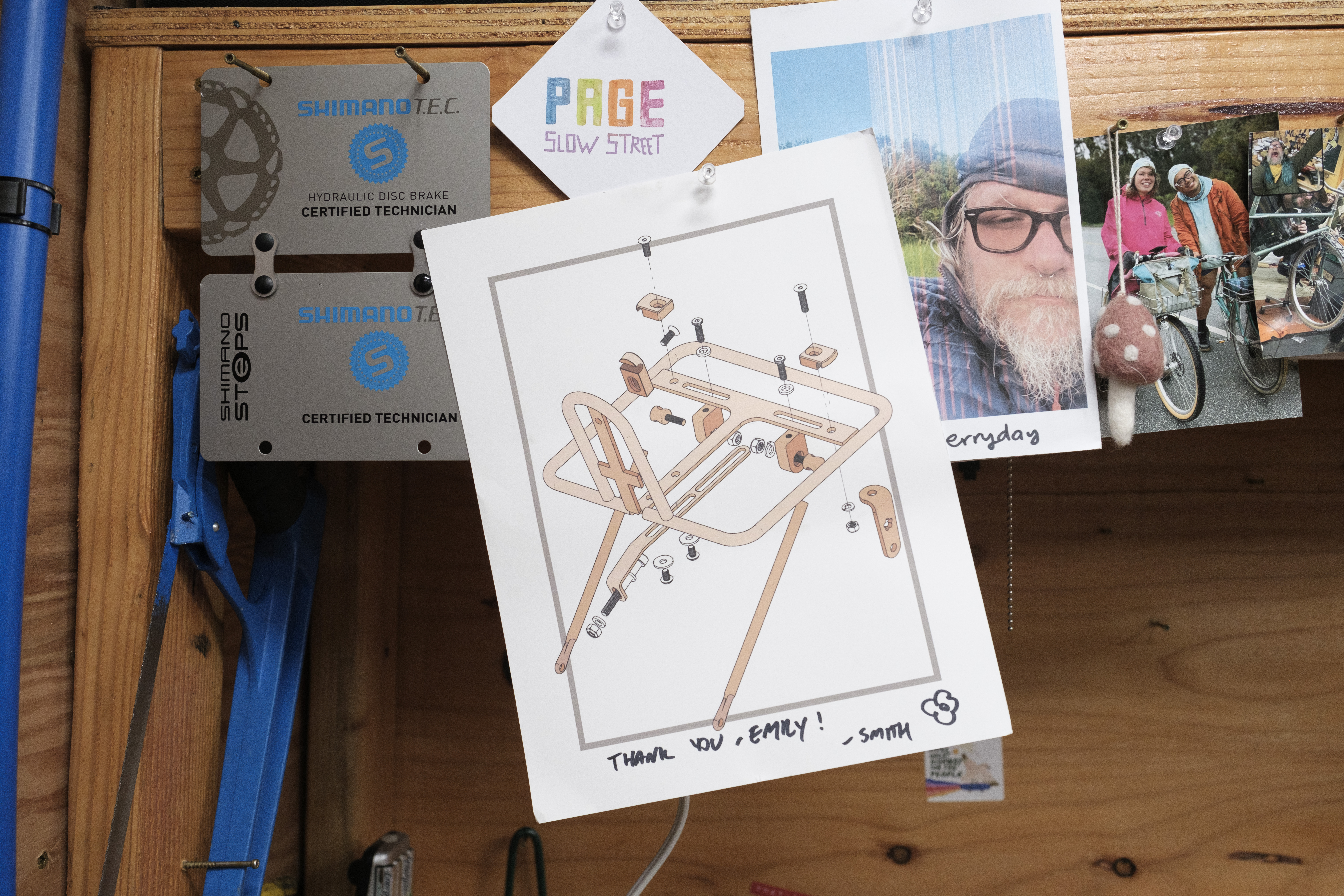 A poster hung-up on a shop bench with an exploded view of the RIP Rack.